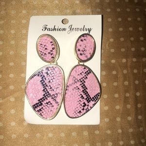 Gold, pink, and black animal print earrings.